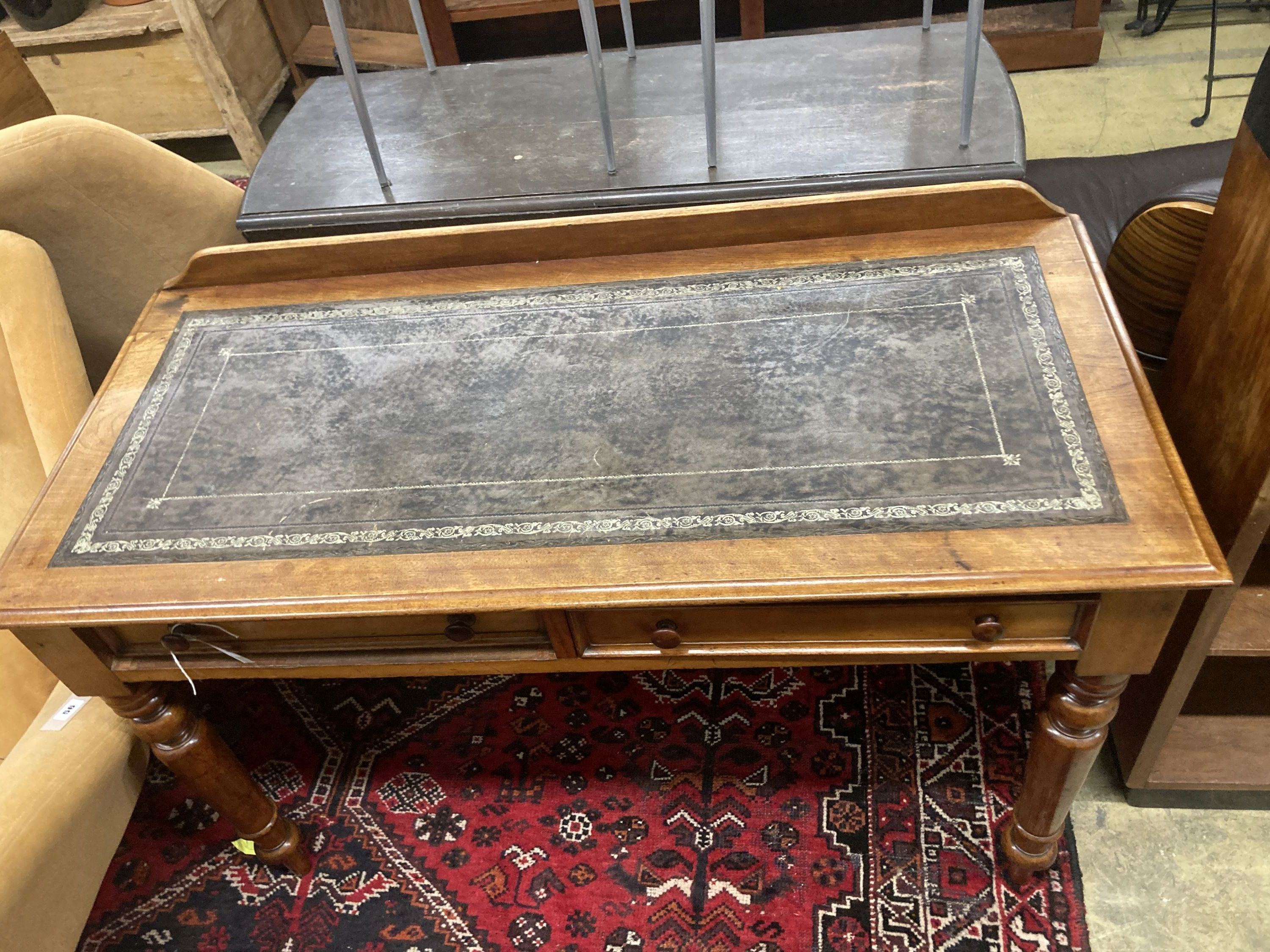 A Victorian mahogany two drawer writing table, with a leather inset top, width 114cm, depth 52cm, height 80cm